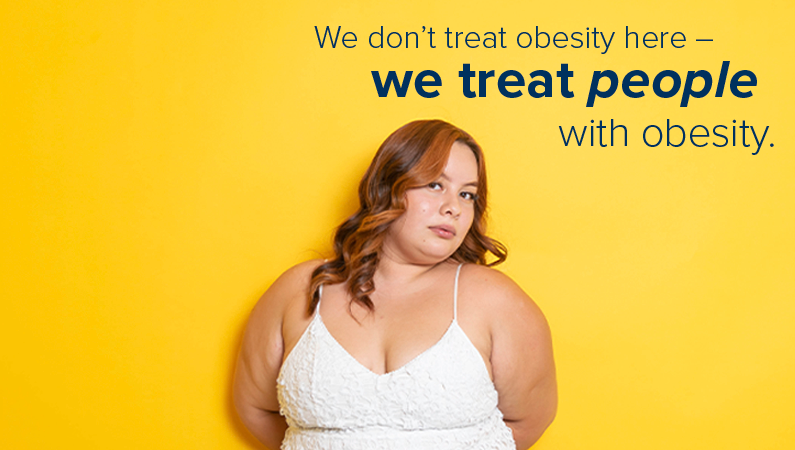 Female in front of a yellow background with text that says "We don't treat obesity here - we treat people with obesity."