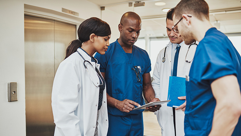 A group of medical professionals working together in a hospital setting.