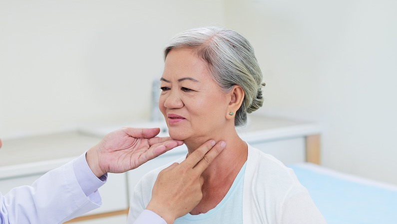 Older patient in medical office setting getting checked