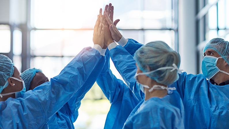 Group of medical professionals working together in hospital setting