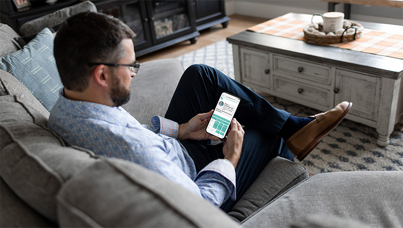 Male at home scheduling appointment with his provider online