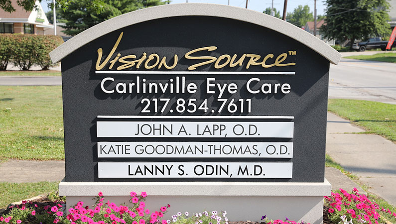 Black sign at the entrance of Carlinville Eye Care in Carlinville, Illinois