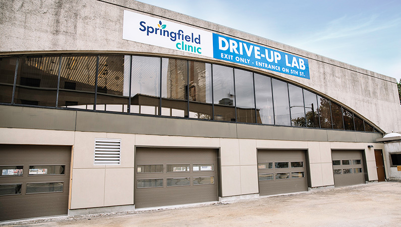 Drive-up laboratory facility with four garage doors