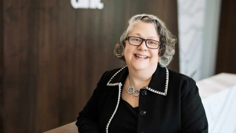 Rebecca Birenbaum smiling in professional photograph