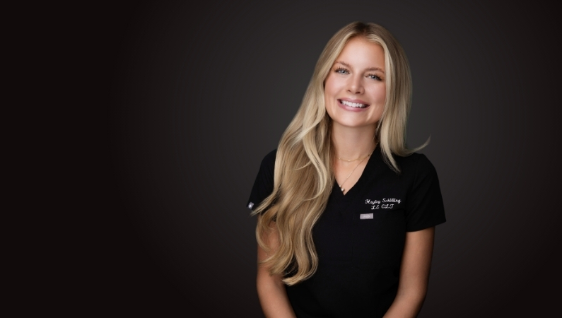 Female aesthetician smiling in professional headshot