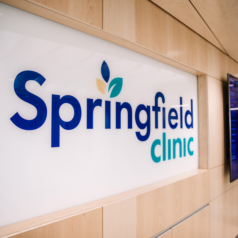 Building interior with light wood wall and Springfield Clinic logo