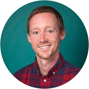 William Hernan, manager of HR Administration, headshot on green background.