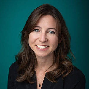 Female physical therapist smiling in professional headshot.