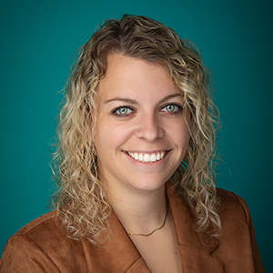 Female licensed counselor smiling in professional headshot.