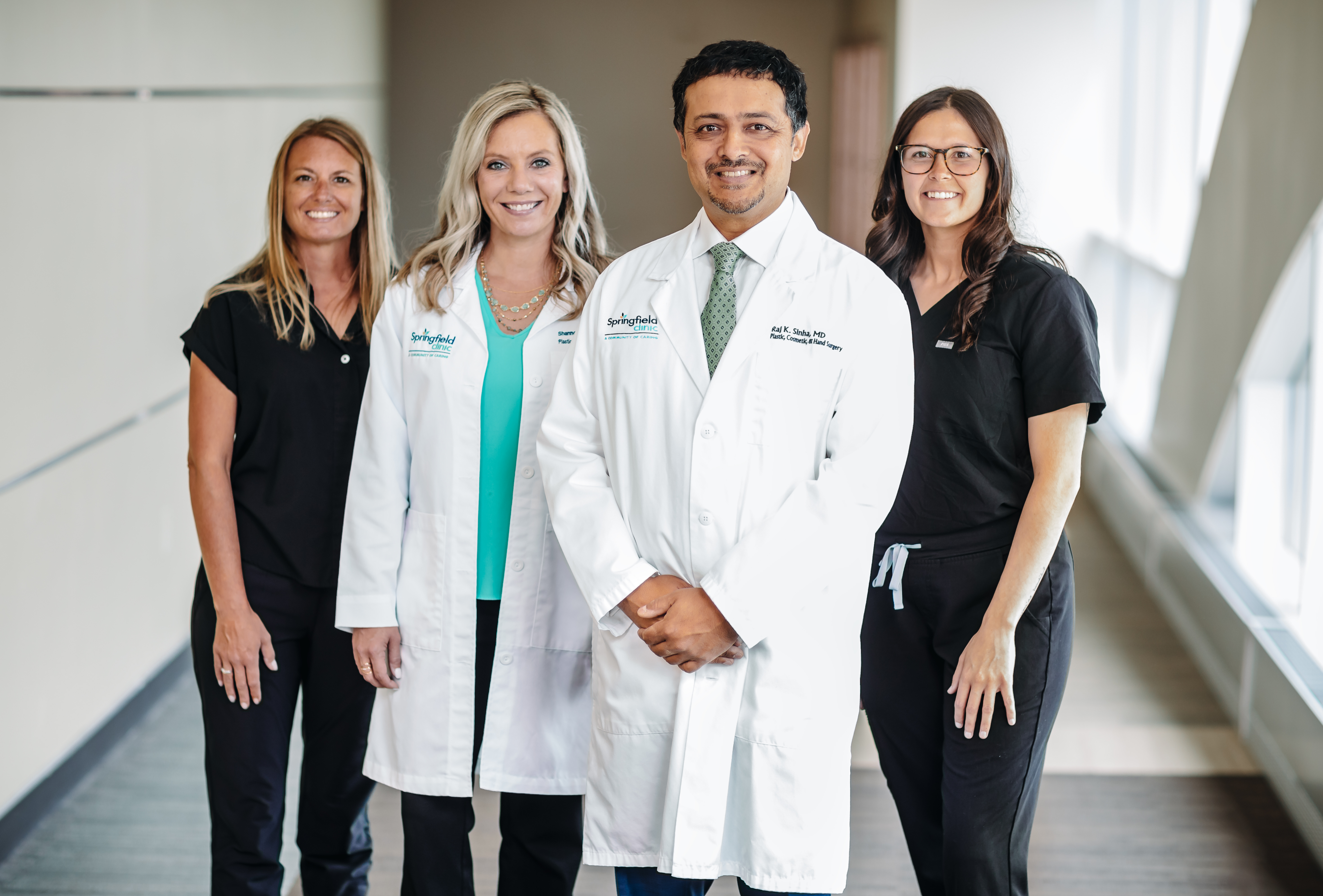 Dr. Raj Sinha, Shannon Fasig, APRN and medical team standing for a group shot.