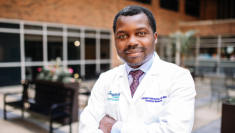 Man smiling outside the clinic.