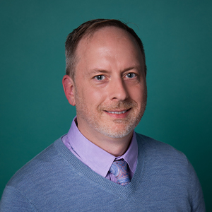 Male nurse practitioner professional headshot.