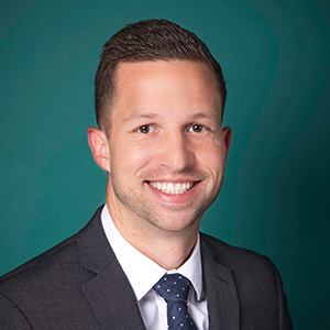 Male interventional spine care doctor headshot