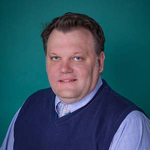 Male doctor professional headshot.