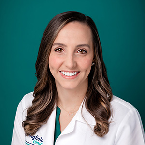 Female internal medicine doctor professional headshot.