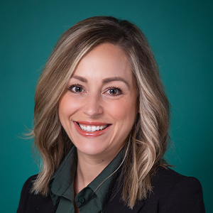 Female family medicine nurse practitioner headshot.