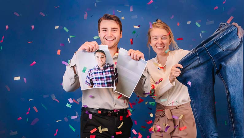 Man and woman smiling with confetti in the air celebrating their bariatric win.