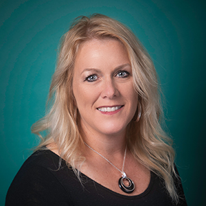 Female family medicine nurse practitioner headshot.