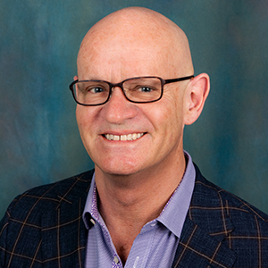 Male family medicine doctor headshot.