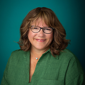 Female occupational therapist smiling in professional headshot