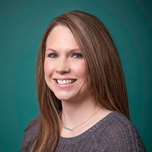 Female family medicine nurse practitioner headshot.