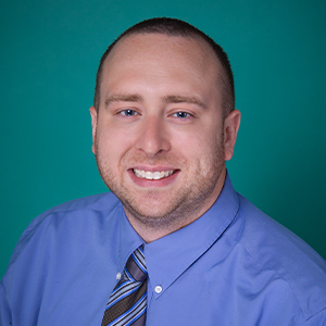 Male trauma surgery nurse practitioner professional headshot.