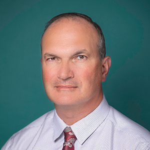 Male orthopedics doctor headshot.
