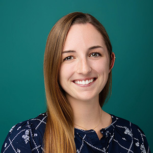 Female audiologist smiling in professional headshot