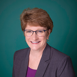 Female general surgery nurse headshot.