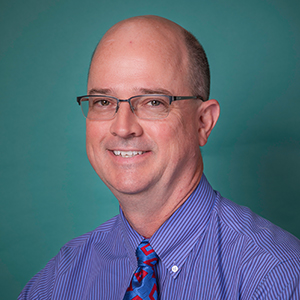 Male general surgery doctor headshot.