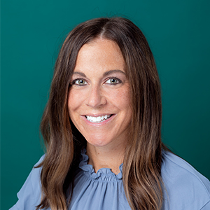 Female family medicine nurse practitioner professional headshot.