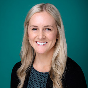 Female dermatologist professional headshot.