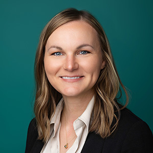 Nurse practitioner smiling in professional headshot.