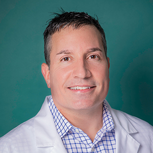 Male orthopedics doctor headshot.