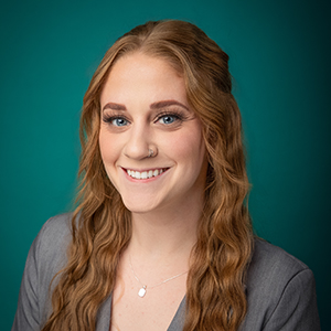 Female licensed professional counselor smiling in professional headshot.