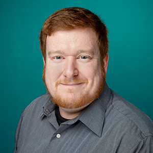 Male nurse practitioner professional headshot.