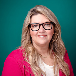 Female nurse practitioner professional headshot.