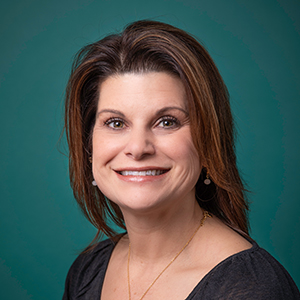 Female family medicine nurse practitioner headshot.