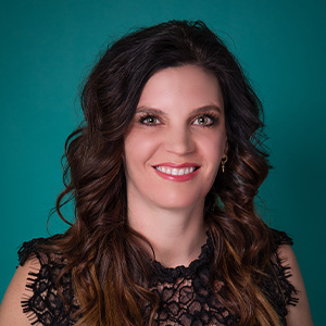 Female plastic surgery nurse professional headshot.
