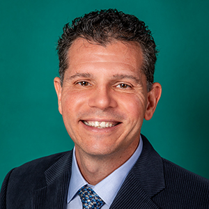 Male general surgery doctor headshot.