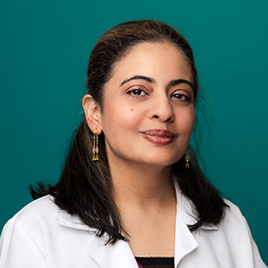 Female doctor smiling in a professional headshot.