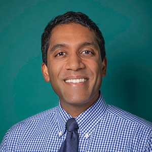 Male interventional spine care doctor headshot