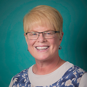 Female family medicine doctor headshot.