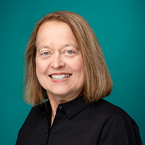 Female physical therapist smiling in professional headshot.