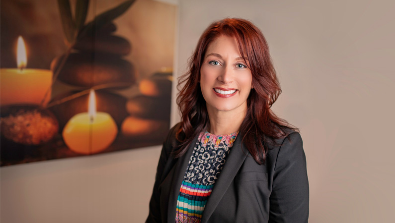 Female chiropractor smiling.