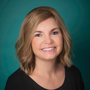 Female family medicine nurse practitioner headshot.