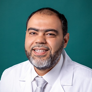 Professional headshot of male nephrology doctor.