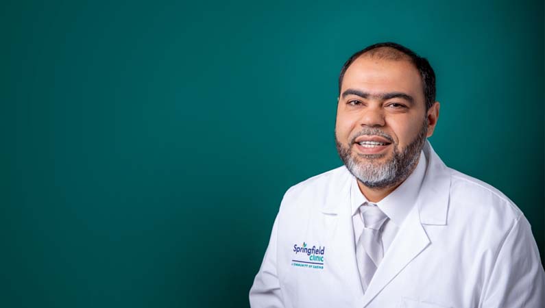 Professional headshot of male nephrology doctor.