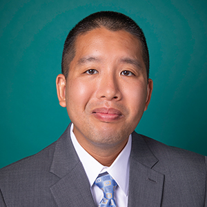 Male family medicine doctor headshot.