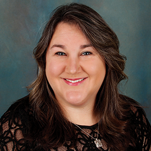 Female family medicine nurse practitioner headshot.